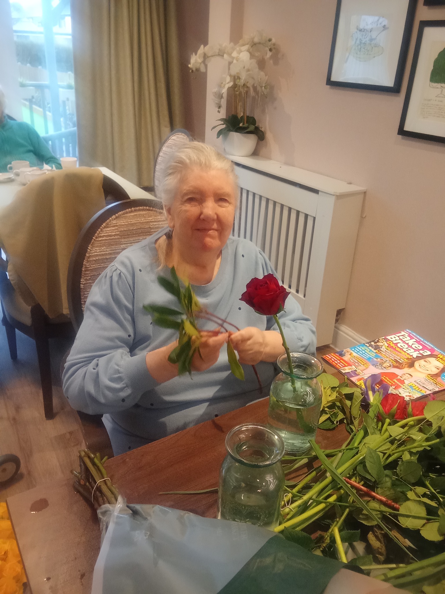 Meadowbrook residents arranging donated flowers from M&S