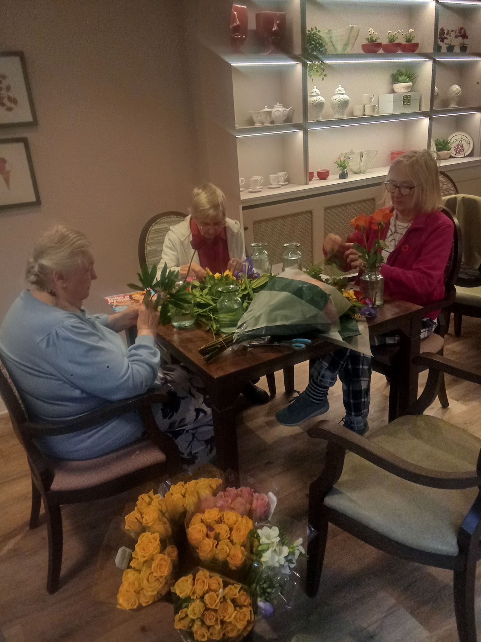 M&S Foodhall staff presenting flower donation to Meadowbrook care home