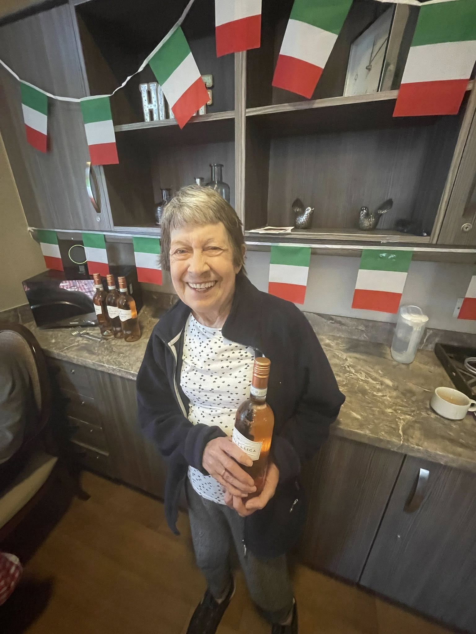 Twelve Trees care home resident enjoying Italian themed day celebration