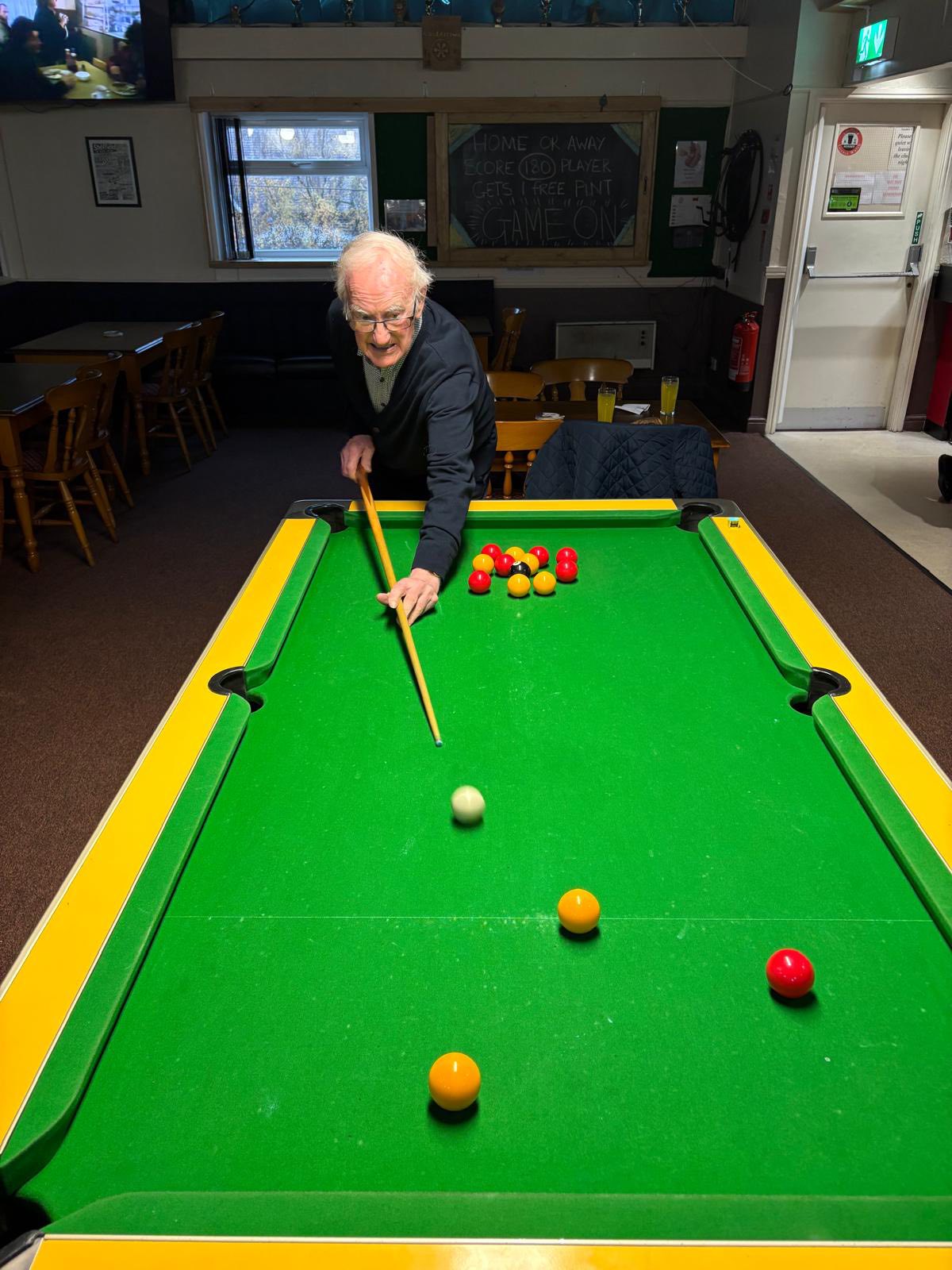Twelve Trees care home resident Michael enjoying a game of pool at local snooker hall
