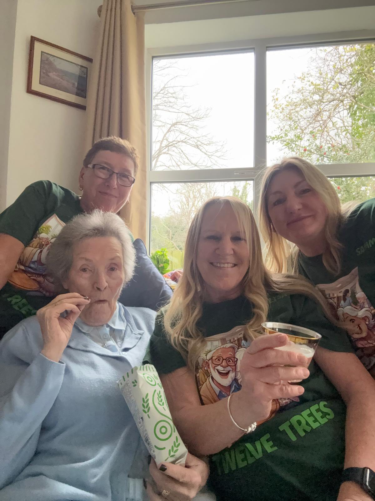 Staff member and resident enjoying the celebration buffet together at Twelve Trees 30th anniversary