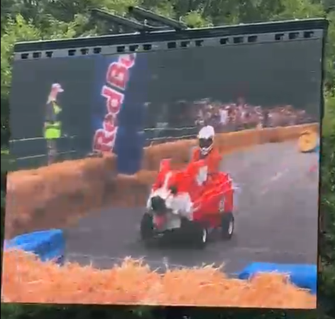 Belly Low and Ready To Go cross the finish line, shown on the big screen at the Red Bull Soapbox Race