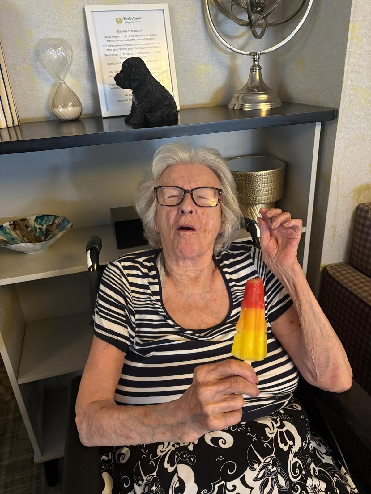 Resident at Twelve Trees care home enjoying an ice lolly to keep cool and hydrated