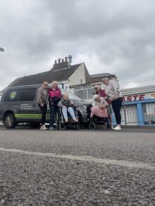 Meadowbrook care home residents in Garforth enjoying a day out together with staff support